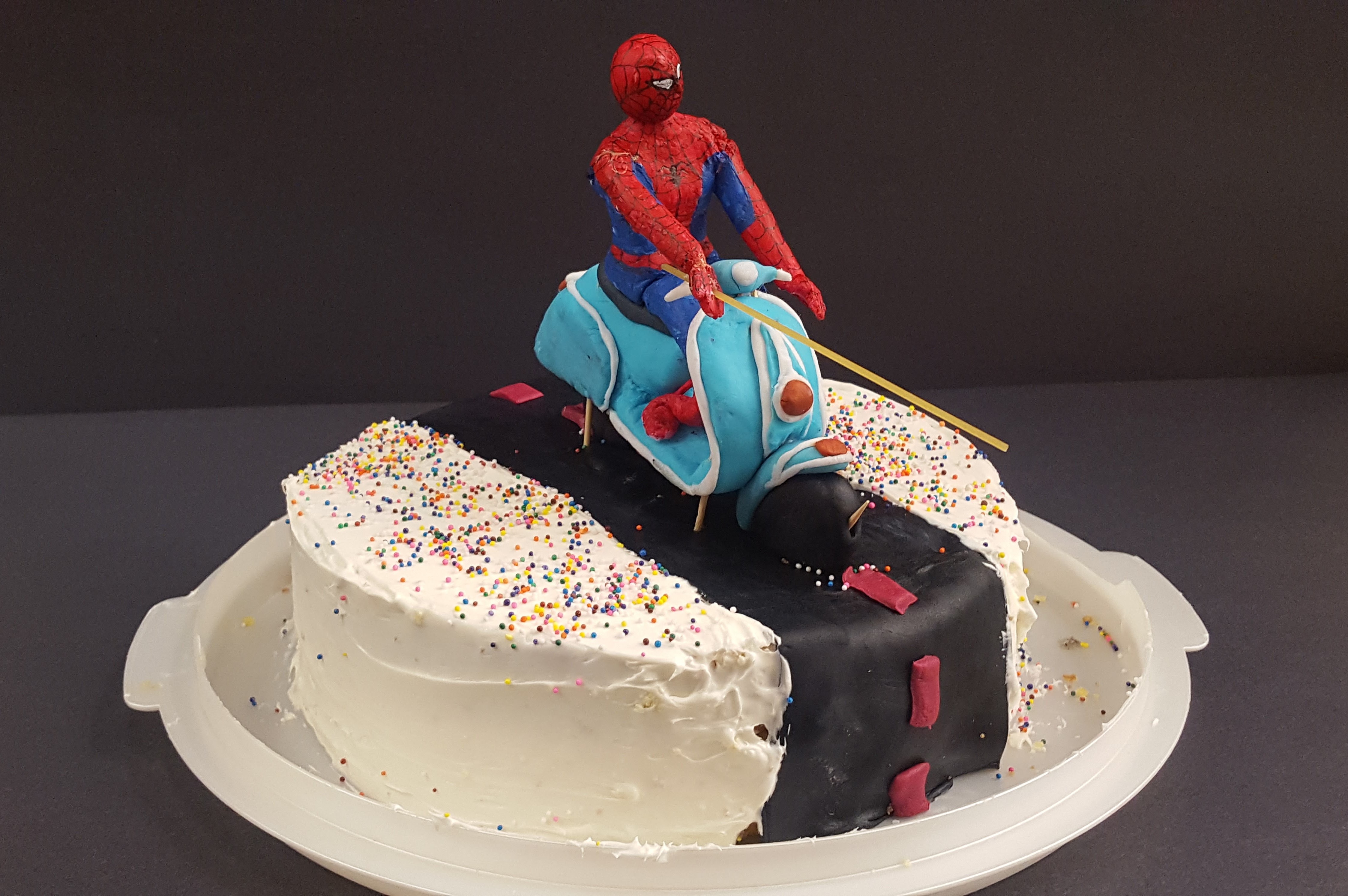 Linoblock is a rad medium I was excited to work with again, but I wanted a new challenge, something with quirk for my quirky vision of Spiderman riding a Vespa and slinging spaghetti.
                 So I tried it with cake fondant, which isn't easily paintable or structurally sound. Spidey's limbs sacrifice rigid joints for a more fluid bend and the fondant spaghetti was replaced with a piece of actual dried spaghetti. Placed on a cake and submitted on my teachers actual birthday, easily the most fun project that year